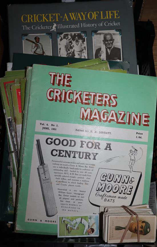 A collection of cricket memorabilia, magazines, score cards etc